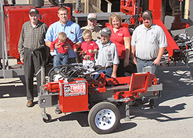Clyde and family taking possession of the 20000th Timberwolf machine